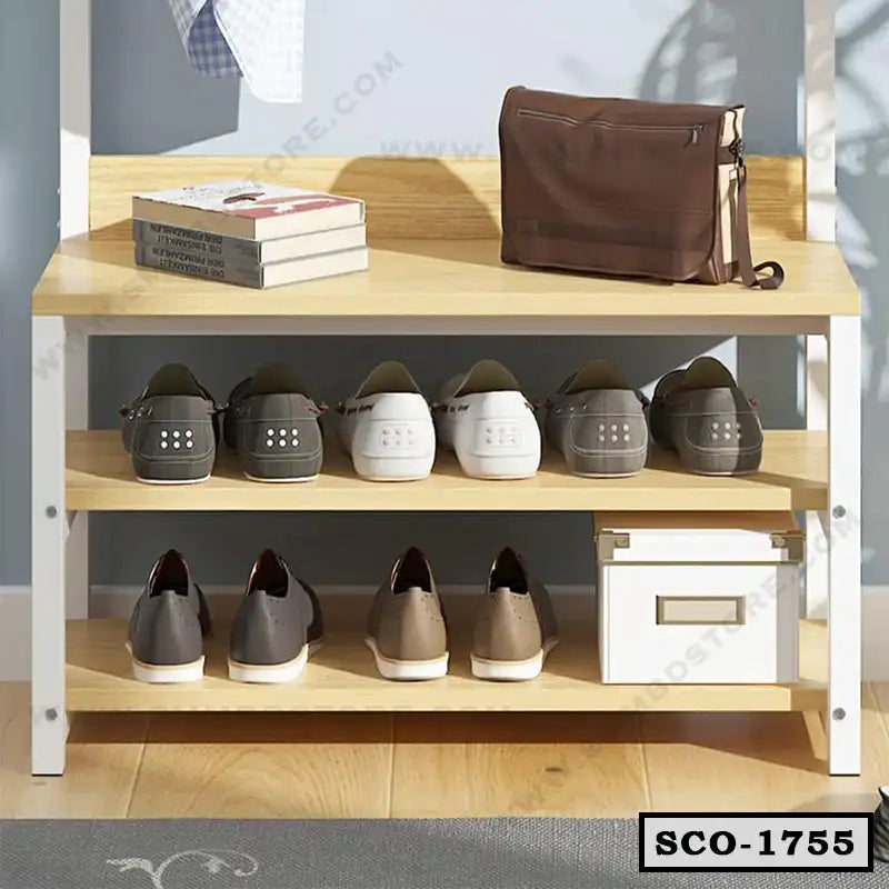 Standing closet organizer with shelves, shoes, storage box, books, and a brown bag