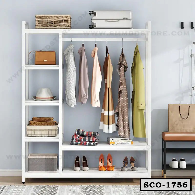 White standing closet organizer with shelves, hanging space, and shoes neatly arranged