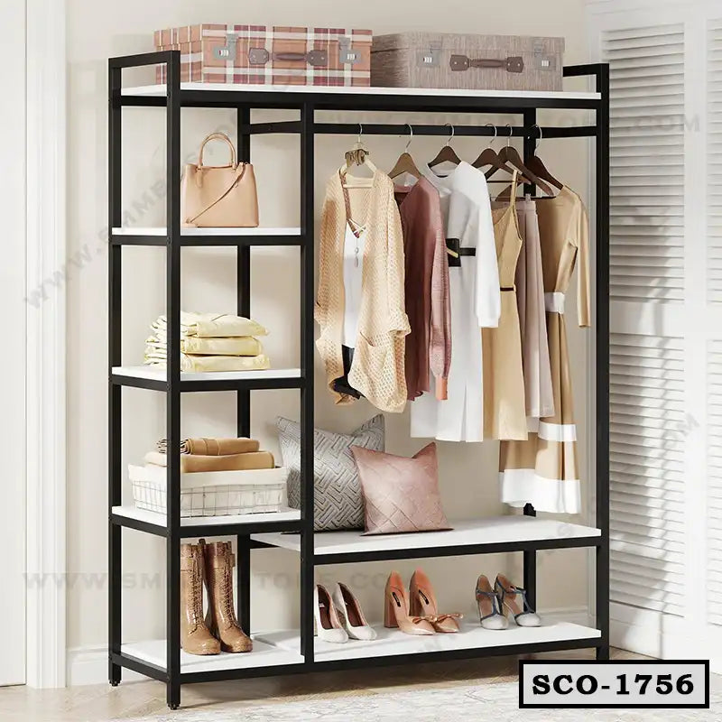 Standing closet organizer with shelves, hanging clothes, pillows, boxes, shoes, and bags Main image