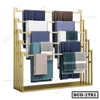 Modern standing closet organizer with gold metal frame and multiple clothing racks