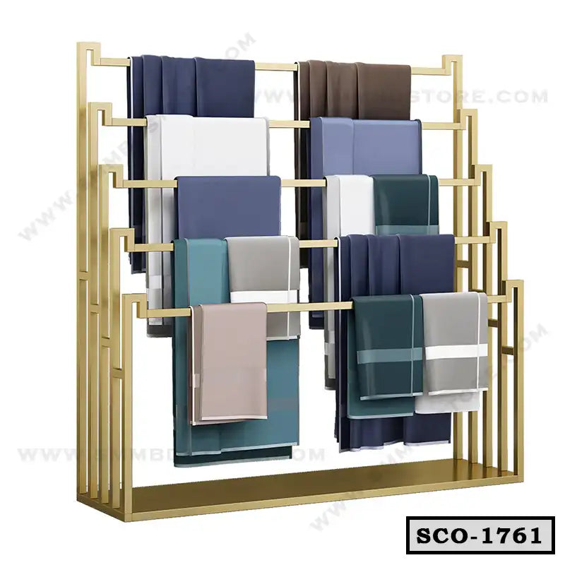 Modern standing closet organizer with gold metal frame and multiple clothing racks