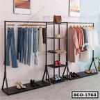 Standing closet organizer with shelves and hanging rods for clothes, shoes, and bags