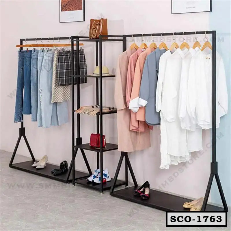 Standing closet organizer with hanging racks, shelves, and assorted clothes and shoes Main image