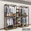 Standing closet organizer with black metal frame, wooden shelves, and hanging suits