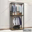 Standing closet organizer with metal frame, hanging clothes, shelves, and storage bag