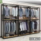 Modern standing closet organizer with metal frame, hanging suits, shelves, and storage compartments