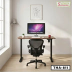 Modern standing desk with computer, ergonomic chair, and minimalist office decor