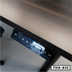 Close-up of standing desk control panel with programmable memory buttons and wood tabletop