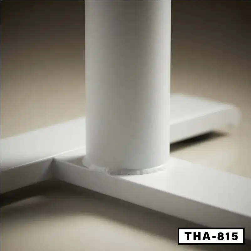 Close-up of sturdy white standing desk leg with THA-815 model label, modern office furniture