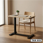 Modern standing desk with wooden top, black metal legs, chair, and home office decor