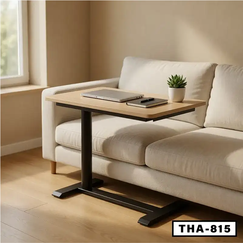 Modern standing desk with wooden top and black base beside a beige sofa in a bright room