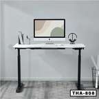 Modern standing desk with white tabletop, double motors, and computer setup in home office