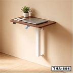 Wall-mounted standing laptop table with wooden top, metal leg, and workspace items