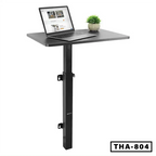 Modern wall-mounted standing laptop table with metal support, laptop and plant on top