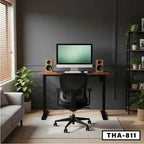 Modern standing desk with office chair, computer, and speakers in a stylish home office setting