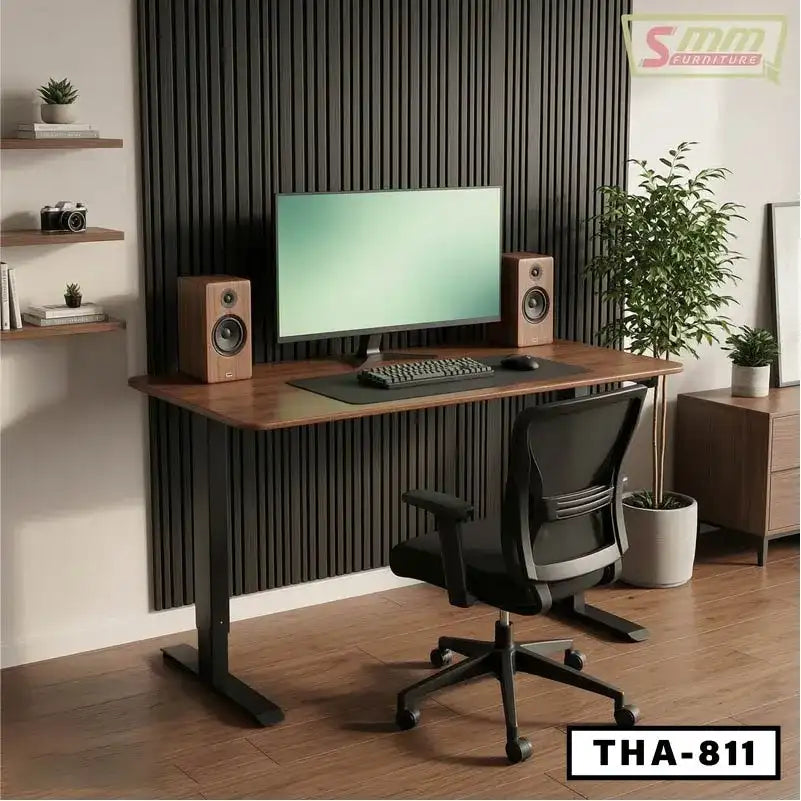 Modern home office setup with wooden standing desk, monitor, ergonomic chair, and speakers