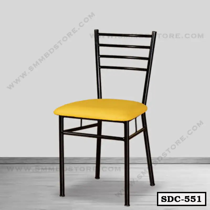 Modern steel dining chair with black frame and yellow cushion in minimalist room Main image