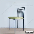 Modern steel dining chair with green cushioned seat and black metal frame, model SDC-555