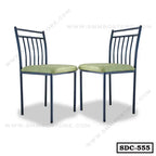 Pair of steel dining chairs with green cushioned seats and vertical slat backs