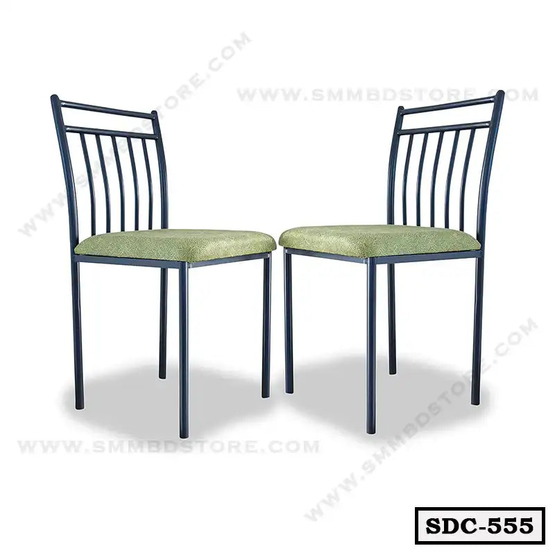 Pair of steel dining chairs with green cushioned seats and vertical slat backs