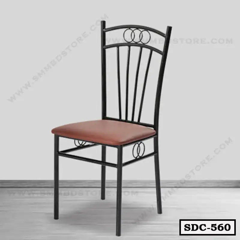 Modern steel dining chair with brown cushioned seat and decorative black metal frame Main image