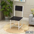Modern steel dining chair with black seat and backrest, white frame, in a stylish living room.