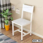 White steel dining chair with square seat in a modern home corner, wooden floor, houseplant nearby.