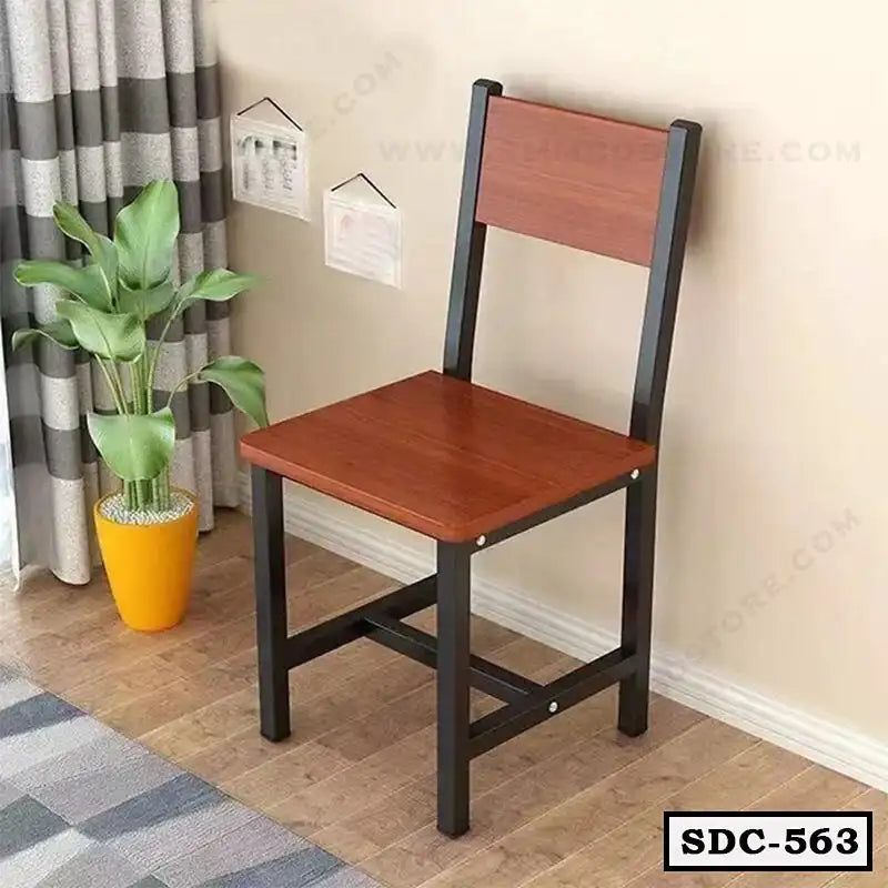 Modern steel dining chair with wooden seat and backrest in a cozy home setting