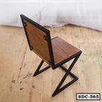 Modern steel-frame dining chair with wooden seat and back on a wooden floor