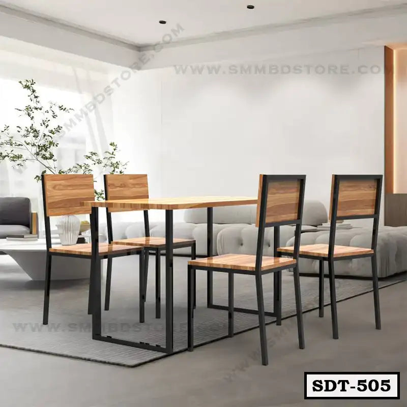 Modern steel and wood dining table set with four chairs in a bright living room