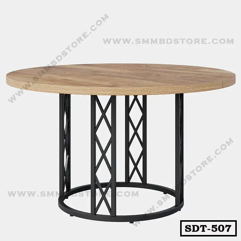 Round steel dining table with a wooden top and geometric black metal base on light background.