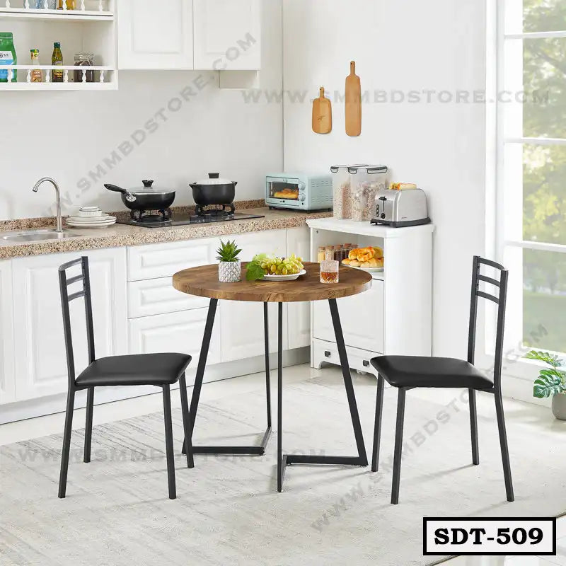 Modern steel and wood dining table set with two black chairs in a white kitchen Main image