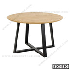 Modern round dining table with wood top and black metal legs, minimalist home furniture
