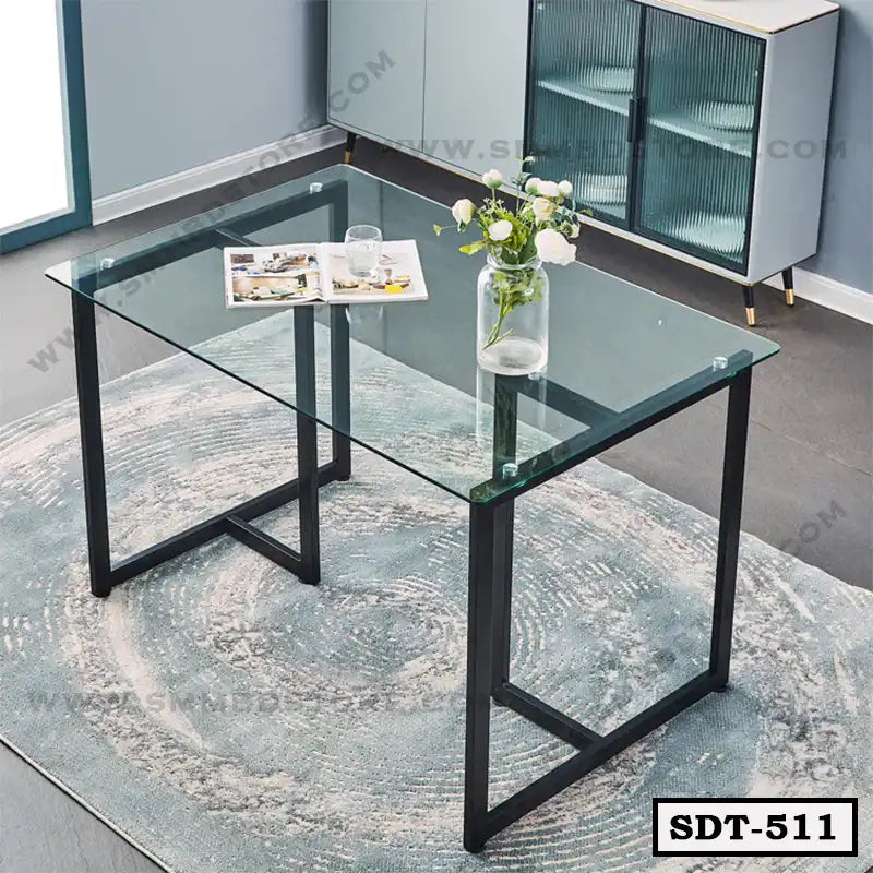 Modern glass and steel dining table SDT-511 on a rug in a contemporary room