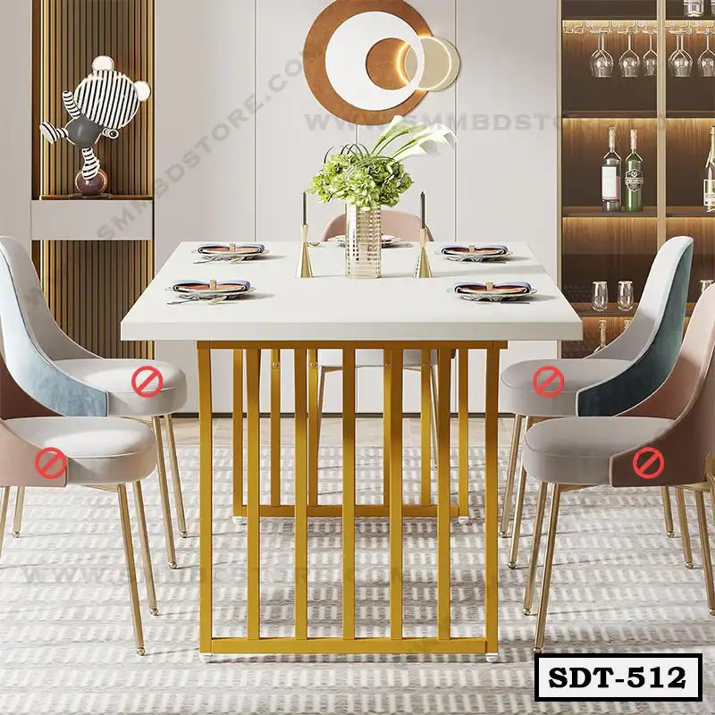 Modern steel dining table with gold frame, white top, and upholstered chairs in a stylish room