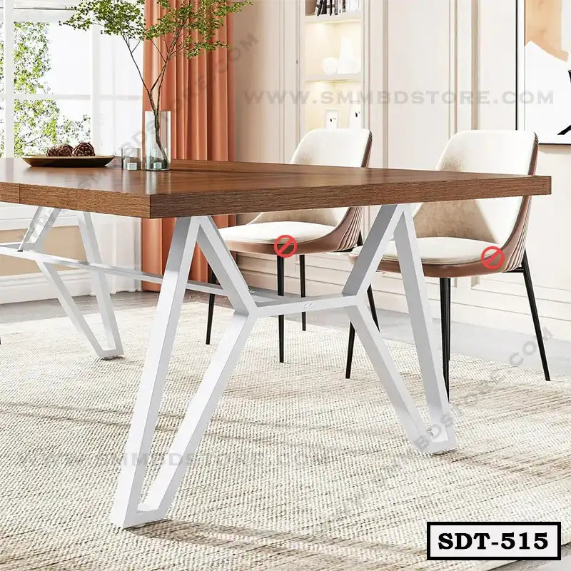 Modern steel dining table with wooden top and white metal legs in a bright dining room