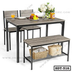 Modern steel dining table set with chairs and bench, featuring a wood finish and table decor.