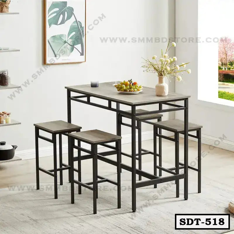Modern steel dining table with matching stools in a bright dining room setting