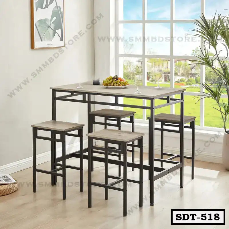 Modern steel dining table set with four stools in a bright room by large window