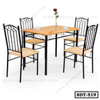 Modern steel dining table with wooden top and four matching chairs, set for dining