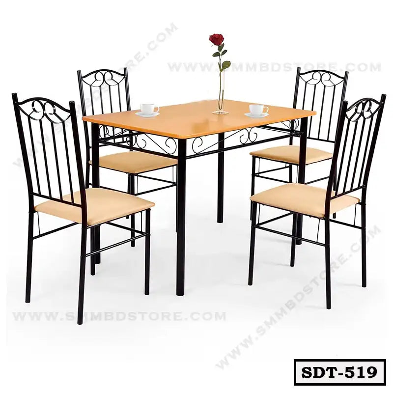 Modern steel dining table with wooden top and four matching chairs, set for dining