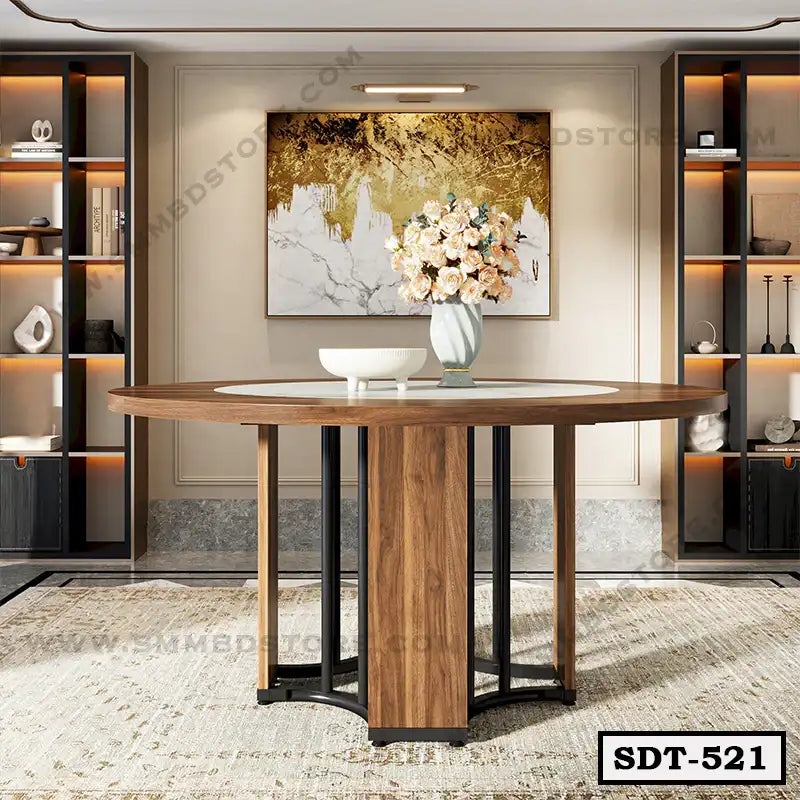 Modern round wooden dining table with steel legs in a stylish dining room setting