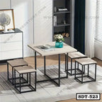 Modern steel dining table set with four square stools in a stylish room setting