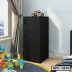Black steel file cabinet with three lockable drawers in a modern room by a window