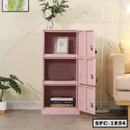 Pink steel file cabinet with three compartments, open doors, and books in a modern living room
