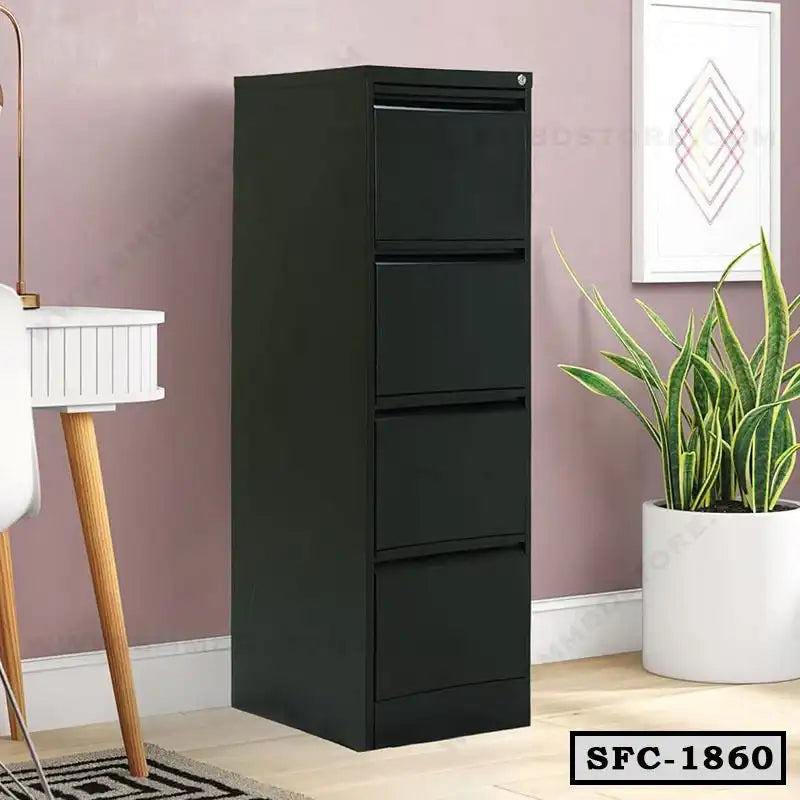 Black steel file cabinet with four drawers in a modern office setting, next to a plant and desk. Main image