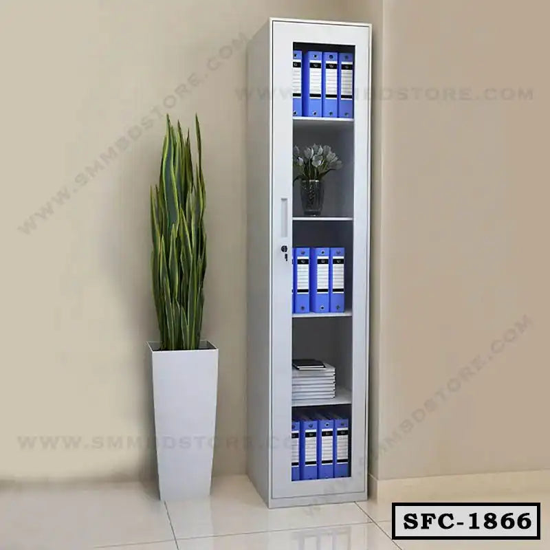 Tall steel file cabinet with glass door and shelves, placed beside a potted plant in an office.