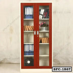 Steel file cabinet with glass doors, shelves holding office files, books, and a plant