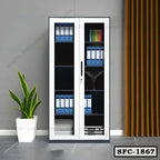 Steel file cabinet with glass doors, organized office folders, and indoor plant beside curtain