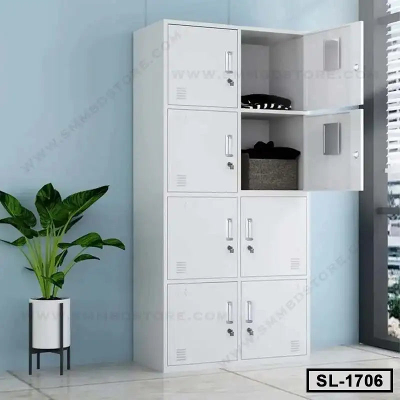 White steel locker cabinet with six compartments in a modern office setting, next to a potted plant. Main image
